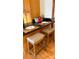 Kitchen breakfast bar with granite countertop and wooden stools at 1409 Trinity Church Rd, Monroe, NC 28112