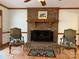 Cozy living room featuring a brick fireplace and hardwood floors at 1409 Trinity Church Rd, Monroe, NC 28112