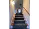 Carpeted staircase leading to upper level with kitchen views at 1409 Trinity Church Rd, Monroe, NC 28112