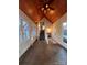 Sunroom with tiled floor, staircase, and wooden ceiling at 1409 Trinity Church Rd, Monroe, NC 28112