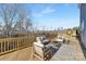 Spacious deck with wooden railings and seating at 2040 White Cypress Ct # Kh09, Charlotte, NC 28216