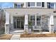 Stone front porch with a seating area, perfect for relaxing outdoors at 2040 White Cypress Ct # Kh09, Charlotte, NC 28216