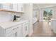 White kitchen cabinets and quartz countertops, open to living room at 2040 White Cypress Ct # Kh09, Charlotte, NC 28216