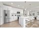 Modern kitchen with white cabinets, stainless steel appliances, and an island at 2040 White Cypress Ct # Kh09, Charlotte, NC 28216