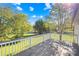 Wooden deck overlooks a large backyard with mature trees at 1025 Bethel Church Rd, Lincolnton, NC 28092