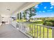 Covered front porch overlooks a grassy yard and quiet street at 1025 Bethel Church Rd, Lincolnton, NC 28092