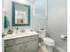 Relaxing powder room with vanity, toilet, and decorative mirror at 121 Canvasback Rd, Mooresville, NC 28117