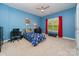 Blue bedroom with twin bed, dresser and window at 121 Canvasback Rd, Mooresville, NC 28117