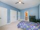 Blue bedroom with twin bed, dresser, and access to bath at 121 Canvasback Rd, Mooresville, NC 28117