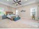 Spacious Primary bedroom with large bed and ceiling fan at 121 Canvasback Rd, Mooresville, NC 28117