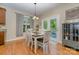 Bright breakfast nook with table and chairs, adjacent to kitchen and backyard access at 121 Canvasback Rd, Mooresville, NC 28117