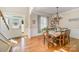 Bright dining room with hardwood floors and a chandelier at 121 Canvasback Rd, Mooresville, NC 28117