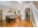 Spacious dining room with hardwood floors, chandelier, and access to kitchen at 121 Canvasback Rd, Mooresville, NC 28117