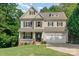 Two-story house with beige siding, a gabled roof, and a front porch at 121 Canvasback Rd, Mooresville, NC 28117