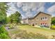 Expansive backyard featuring a patio, picnic table, and lush green lawn for outdoor enjoyment at 16840 Rudence Ct, Charlotte, NC 28278