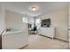 Bright bedroom with a light-colored carpet, a bed, desk, dresser and one window at 16840 Rudence Ct, Charlotte, NC 28278