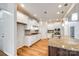 Modern kitchen featuring granite countertops, stainless steel appliances, and ample cabinet space at 16840 Rudence Ct, Charlotte, NC 28278