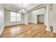 Spacious living room with abundant natural light, hardwood floors, and elegant columns at 16840 Rudence Ct, Charlotte, NC 28278