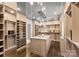 Spacious walk-in closet, featuring built-in shelving and drawers at 4231 Fox Brook Ln, Charlotte, NC 28211