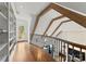 Upper hallway with built-in shelving and wooden flooring at 4231 Fox Brook Ln, Charlotte, NC 28211