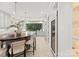 Modern kitchen with gray cabinets, marble countertops, and a breakfast bar at 4231 Fox Brook Ln, Charlotte, NC 28211