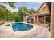 Luxury pool with spacious patio and stone accents at 4231 Fox Brook Ln, Charlotte, NC 28211