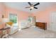 Charming Bedroom with a crib, armchair, and dresser at 7954 Rolling Creek Ct, Charlotte, NC 28270