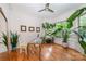 Sunlit home office with built-in shelving and large windows at 7954 Rolling Creek Ct, Charlotte, NC 28270