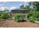 Brick house exterior with a sloped backyard and landscaping at 7954 Rolling Creek Ct, Charlotte, NC 28270