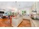 Open concept kitchen with an island, stainless steel appliances and hardwood floors at 7954 Rolling Creek Ct, Charlotte, NC 28270