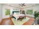 Spacious main bedroom with hardwood floors and large windows at 7954 Rolling Creek Ct, Charlotte, NC 28270