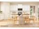 Kitchen with white cabinets, large island, and dining table at 1593 Croydon St, Indian Land, SC 29707