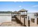 Private wooden dock with covered boat slip and gazebo at 664 Stonemarker Rd, Mooresville, NC 28117