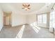 Spacious bedroom with carpet, large windows and ceiling fan at 7954 Bay Pointe Dr, Denver, NC 28037