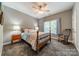 Bedroom with floral bedding and wooden frame bed at 7954 Bay Pointe Dr, Denver, NC 28037