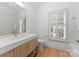 Bathroom with marble vanity and bathtub at 1446 Queens W Rd, Charlotte, NC 28207