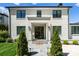 Elegant home exterior with brick facade and black windows at 1446 Queens W Rd, Charlotte, NC 28207