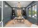 Elegant home office with built-in shelves and a stylish desk at 1446 Queens W Rd, Charlotte, NC 28207