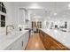 Modern kitchen with double sinks, stainless steel appliances, and stylish backsplash at 1446 Queens W Rd, Charlotte, NC 28207