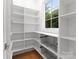 Well-organized pantry with ample shelving and wire baskets at 1446 Queens W Rd, Charlotte, NC 28207