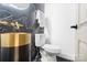 Elegant powder room with gold and black finishes at 3305 Cameo Trl, Gastonia, NC 28056