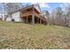 Two-story home with deck overlooking a grassy hillside at 3305 Cameo Trl, Gastonia, NC 28056