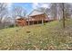 Two-story home with deck overlooking a grassy hillside at 3305 Cameo Trl, Gastonia, NC 28056