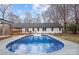 Inviting in-ground pool with wooden deck and backyard at 3305 Cameo Trl, Gastonia, NC 28056