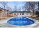 Inviting kidney-shaped pool surrounded by a deck at 3305 Cameo Trl, Gastonia, NC 28056