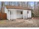 White storage shed with decorative latticework at 3305 Cameo Trl, Gastonia, NC 28056