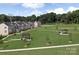 Aerial view of townhomes and community green space at 411 Moondance Dr, Gastonia, NC 28054