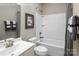 Clean bathroom with a bathtub, toilet, and sink at 411 Moondance Dr, Gastonia, NC 28054