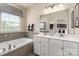 Bathroom with double vanity, soaking tub, and shower at 411 Moondance Dr, Gastonia, NC 28054