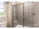 Shower with glass enclosure and built-in seat at 411 Moondance Dr, Gastonia, NC 28054